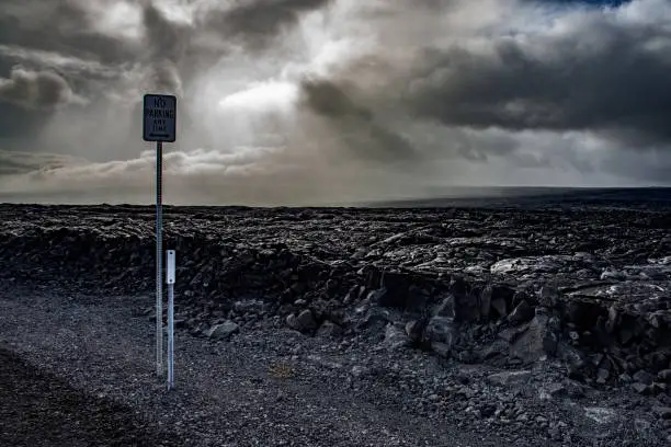 Kīlauea volcanic landscape of Hawaii with roadsigns and cloudscape