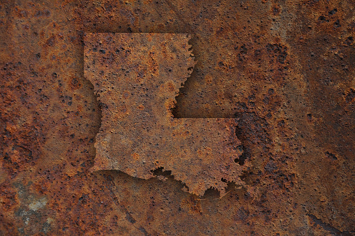 Map of Louisiana on rusty metal