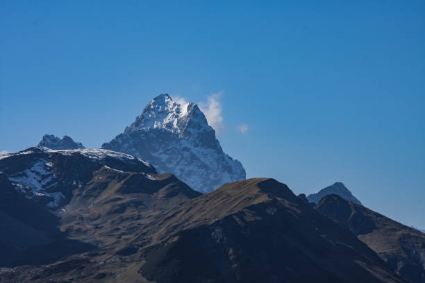 istock Mountain peak in swiss alps 1185839808