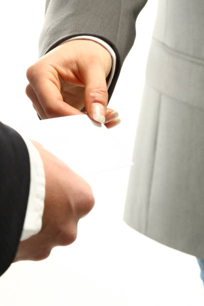 istock two business people echanging business cards 1185839809
