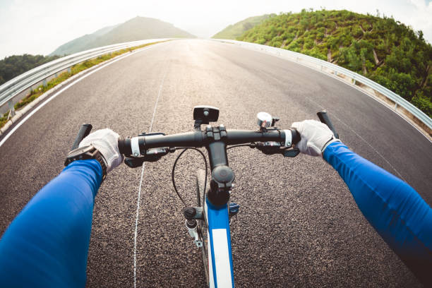 istock Cyclist riding a bike on highway 1185840410