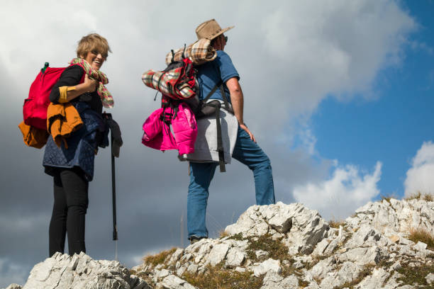 istock Senior couple hiking through the mountains 1185842207