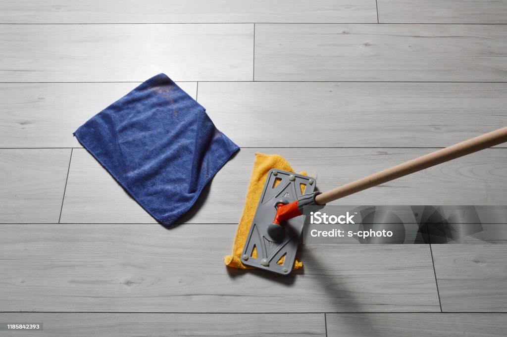 Cleaning Equipments on the Parquet Flooring Chores Stock Photo