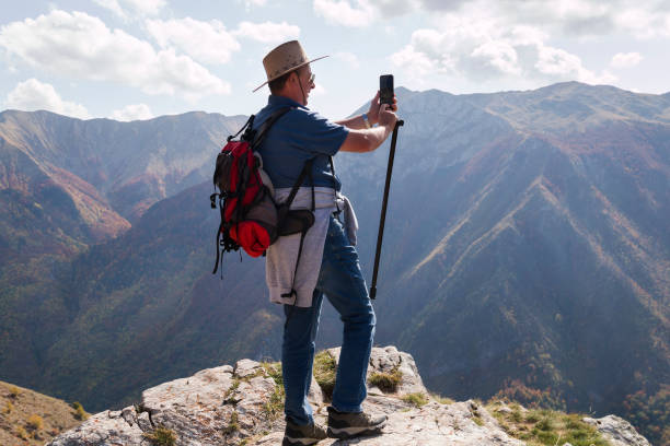 istock Hiker at the edge of a cliff 1185842433
