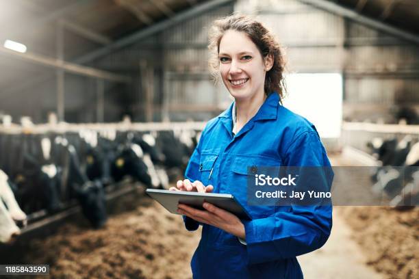 Old School Farming Meets New School Technology Stock Photo - Download Image Now - Coveralls, Farmer, Portrait