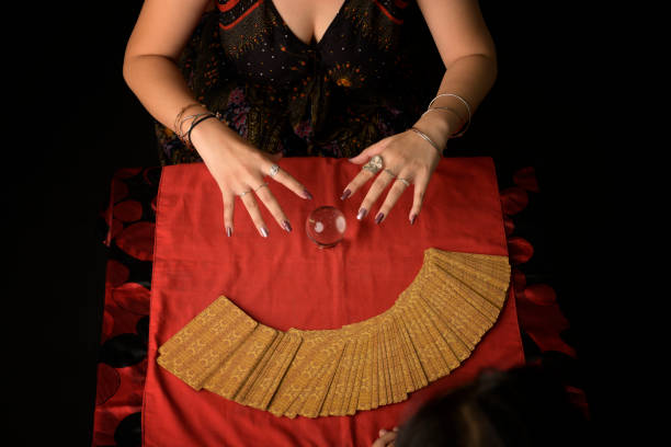 istock Tarot card fortune teller woman hands 1185845525