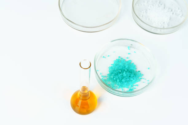 istock Colored liquids inside lab glassware on white table in laboratory 1185845577