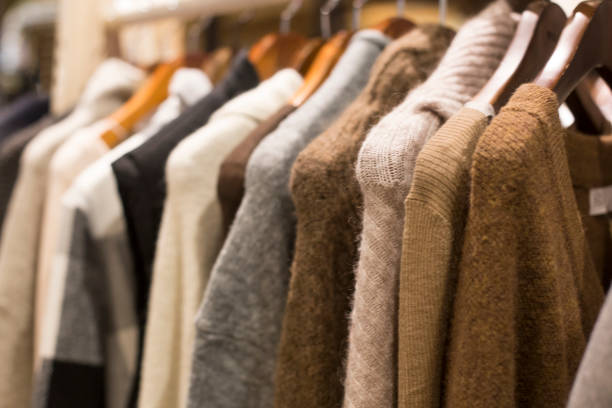 istock Warm winter ladies clothes(knit) on hangers. 1185846156
