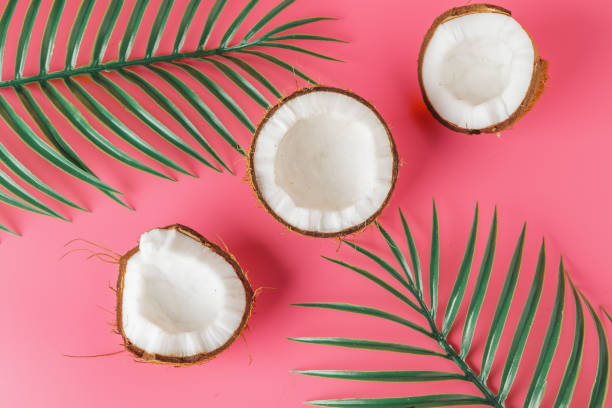 istock Coconut halves on a bright pink background 1185846565