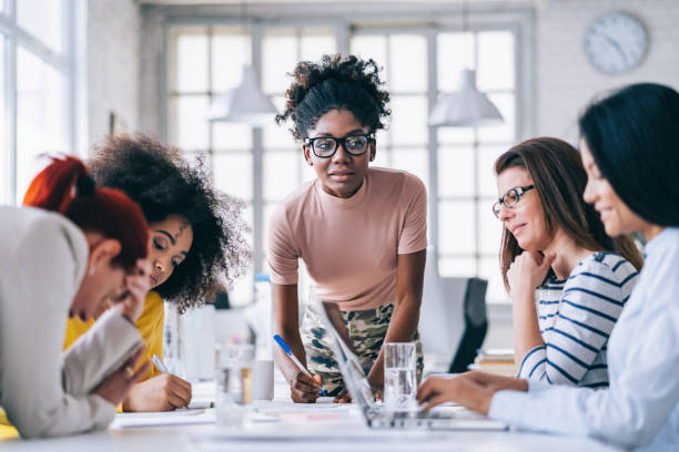 istock Multi-Ethnic women business team having discussion new projects 1185847949