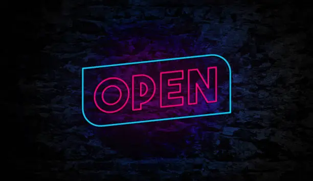 Photo of Open Neon Sign on Brick Wall