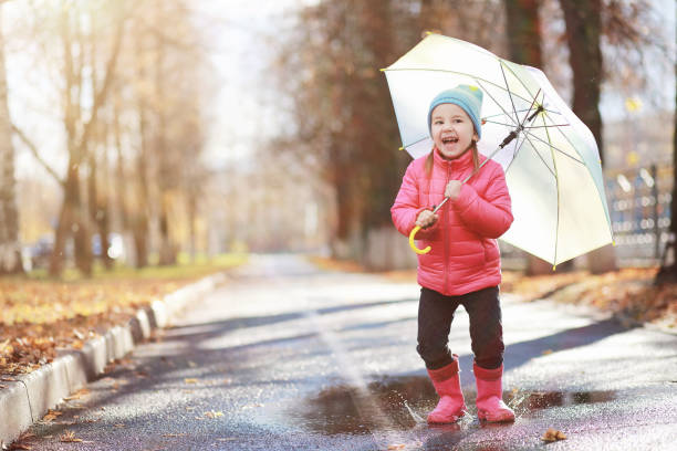 istock Children walk in the autumn park 1185849667