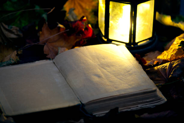 Oil lamp and book.