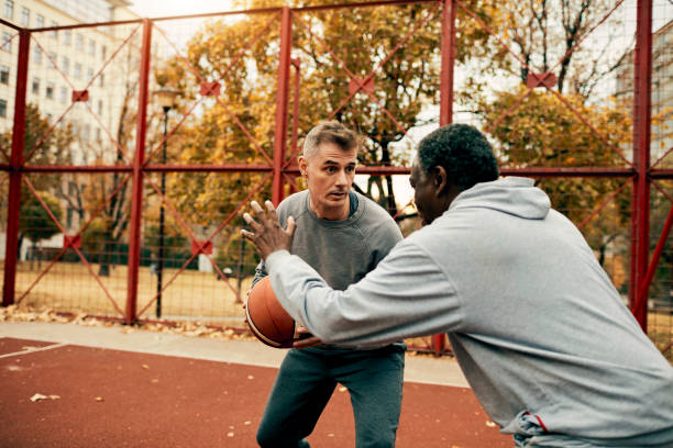 istock Seniors Playing Basketball 1185849782