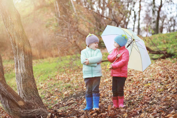 istock Children walk in the autumn park 1185850732