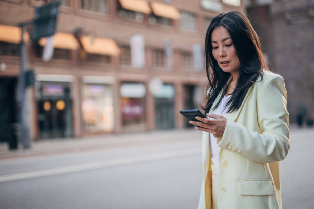 istock Elegant woman text messaging 1185851414