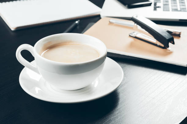 istock Close up of a coffee mug on office table interior 1185851754