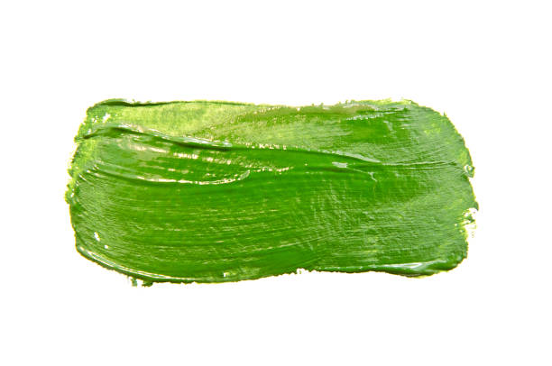 istock Paint brush stroke texture green watercolor isolated on a white 1185852433