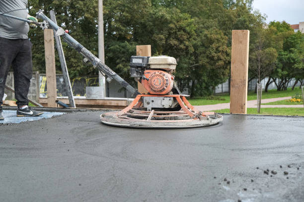 istock the workers grind the concrete floor at the construction site 1185852674