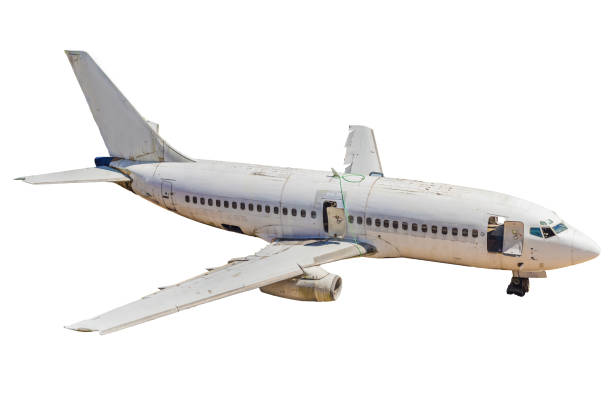 An old passenger aircraft on aviation waste isolated on white