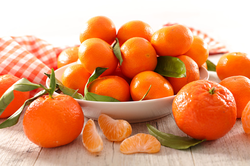 clementine or mandarin, citrus fruit and leaf