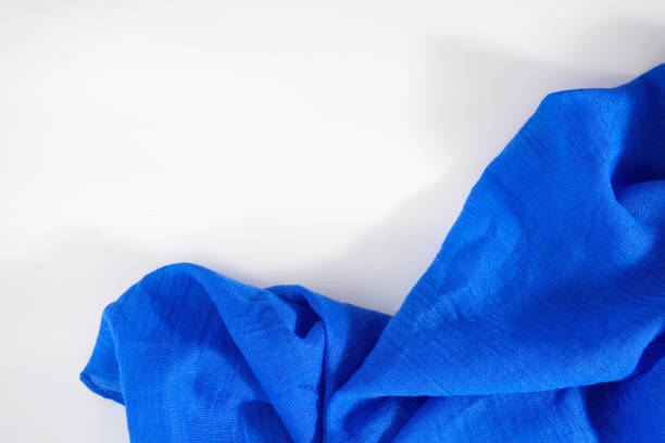 istock Crumpled blue fabric on white background. Copy space for text 1185854153