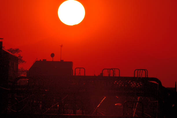 These photos of sunset over Mt Fuji and after sunset were taken from a street of Setagaya Ward, Tokyo, with 600mm telephoto lens. The building structure in front of Mt. Fuji is that of Umegaoka Station,Tokyo, of Odakyu Railways, which is about 100 kilometers away from Mt Fuji.Mt Fuji is designated as UNESCO World Heritage site.