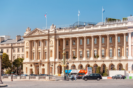 Paris : French National Assembly - Palais Bourbon - with french flag flying. Paris in France