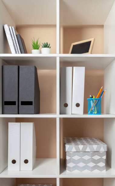 istock File folders, standing on the shelves at office 1185858898