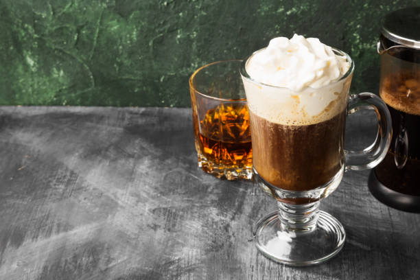 istock Irish coffee with whisky on dark background. Copy space. Food background 1185858988