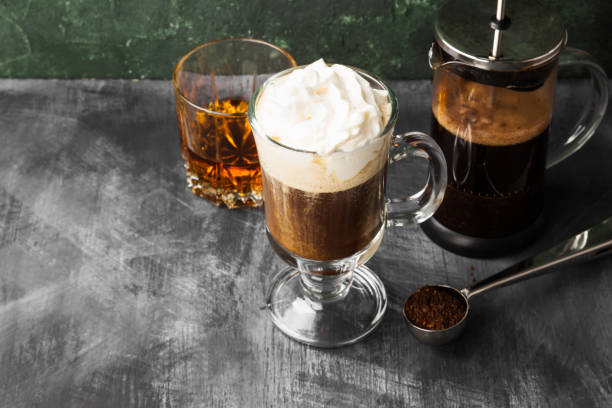istock Irish coffee with whisky on dark background. Copy space. Food background 1185859036