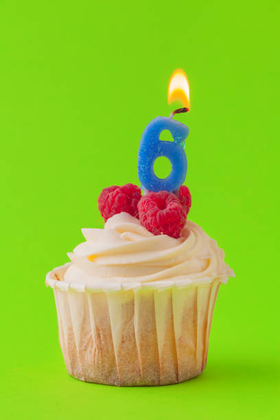 istock Delicious cupcakes with candles on a colored background. Festive background, birthday 1185859985