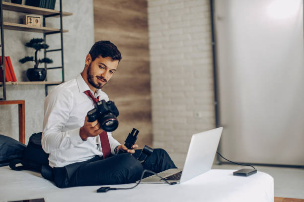istock Photographer reviewing his work 1185862707