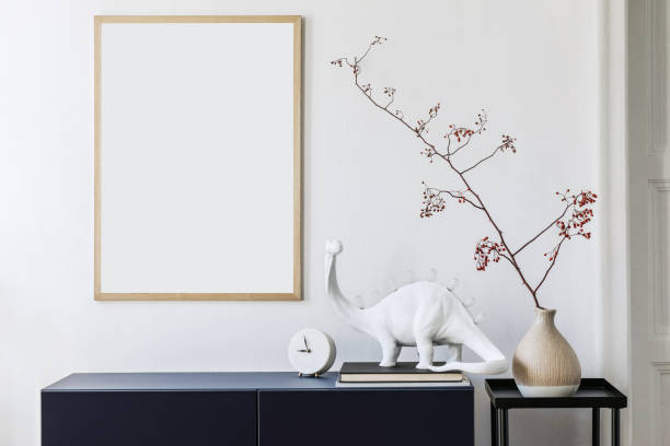 istock Stylish scandinavian living room with mock up poster frame, navy blue commode, table lamp and elegant accessories. Modern home decor. Interior design. Template Ready to use. 1185862888