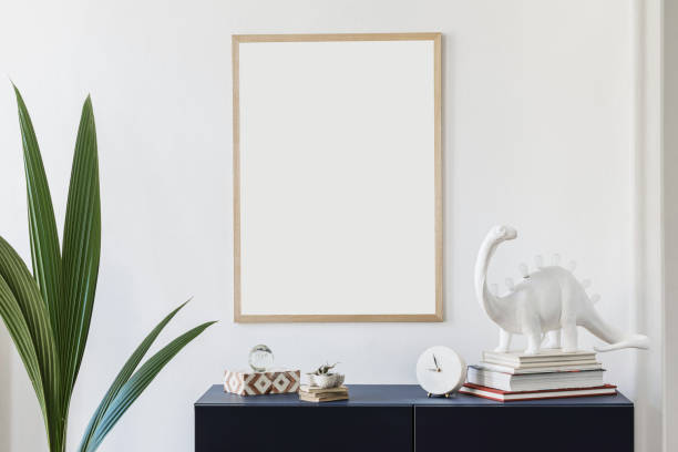 istock Stylish scandinavian living room with mock up poster frame, navy blue commode, table lamp and elegant accessories. Modern home decor. Interior design. Template Ready to use. F 1185863085