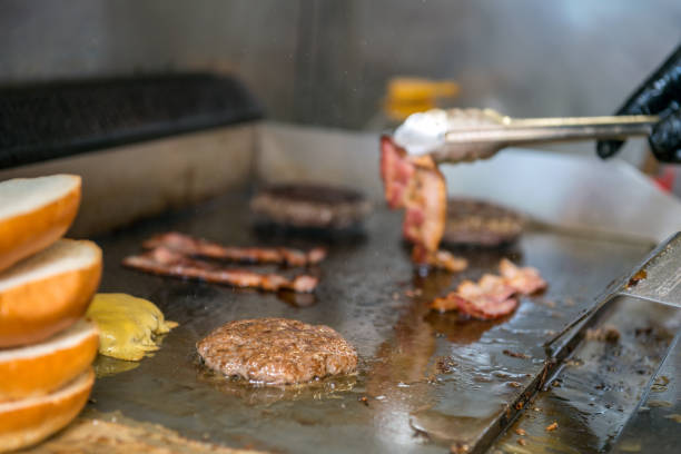 istock Chef making beef burger on the open kitchen. Street fast food 1185863266