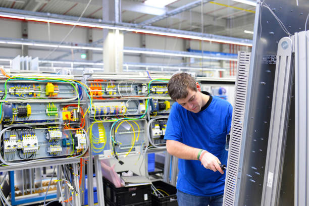 istock young apprentice worker in an industrial company assembling electronic components in the mechanical engineering of a modern factory 1185866291