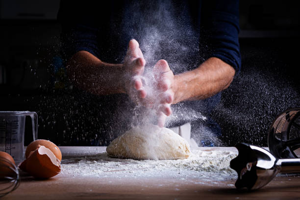istock Male hands making dough for pizza, dumplings or bread. Baking concept. 1185867051