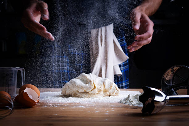 istock Male hands making dough for pizza, dumplings or bread. Baking concept. 1185867056