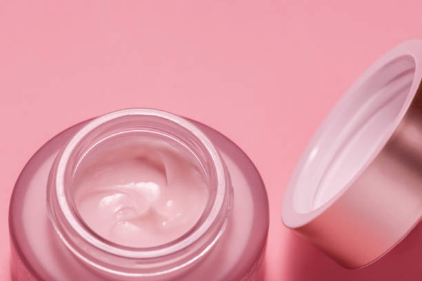 istock Cosmetic cream in a can on a pink background 1185867859