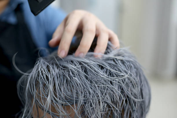 Hair Dye A closer look on blow dry young man's hair in which freshly dyed and washed. johor photos stock pictures, royalty-free photos & images