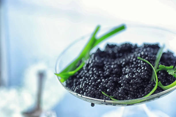 istock Fresh black fish roe. Beluga caviar served with ice. 1185869586