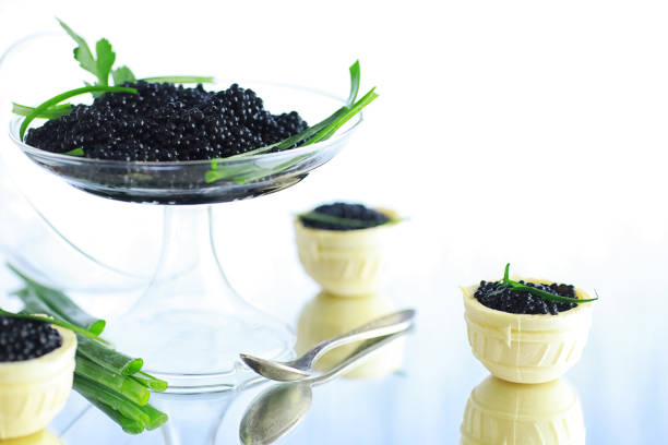 istock Fresh black fish roe. Beluga caviar served with ice. 1185869601