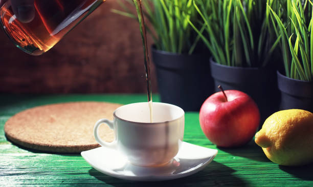 istock Brewing tea on a wooden table 1185871124