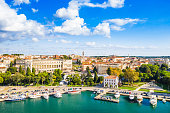 Croatia, Istria, city of Pula, ancient Roman arena, historic amphitheater and harbor with ships