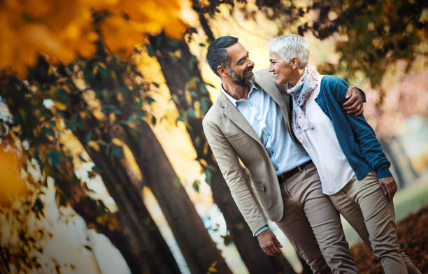 istock Mature couple walking in a park. 1185871460