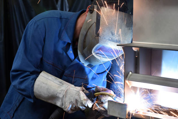 istock welder works in metal construction - construction and processing of steel components 1185872237