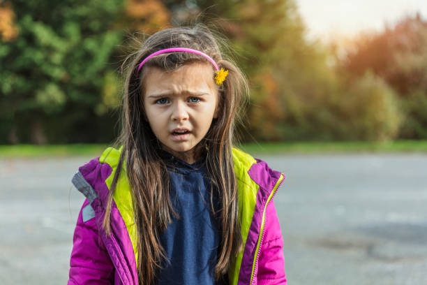 istock Angry little girl looking at camera 1185877792