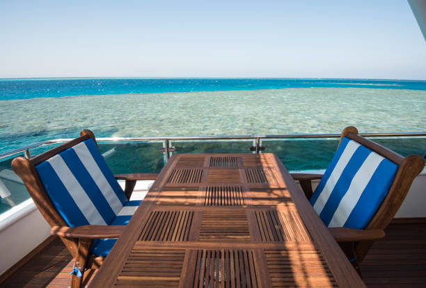 istock Table and chairs on deck of a luxury motor yacht 1185877996