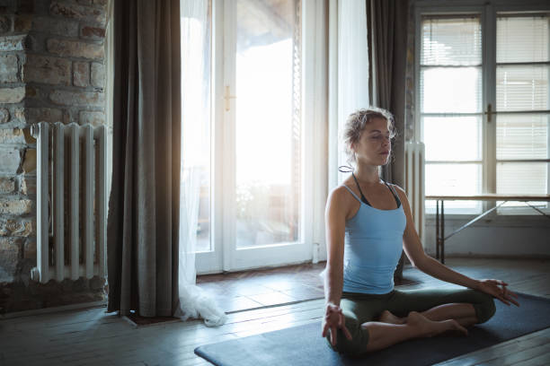 istock Young sporty woman practicing yoga 1185880537